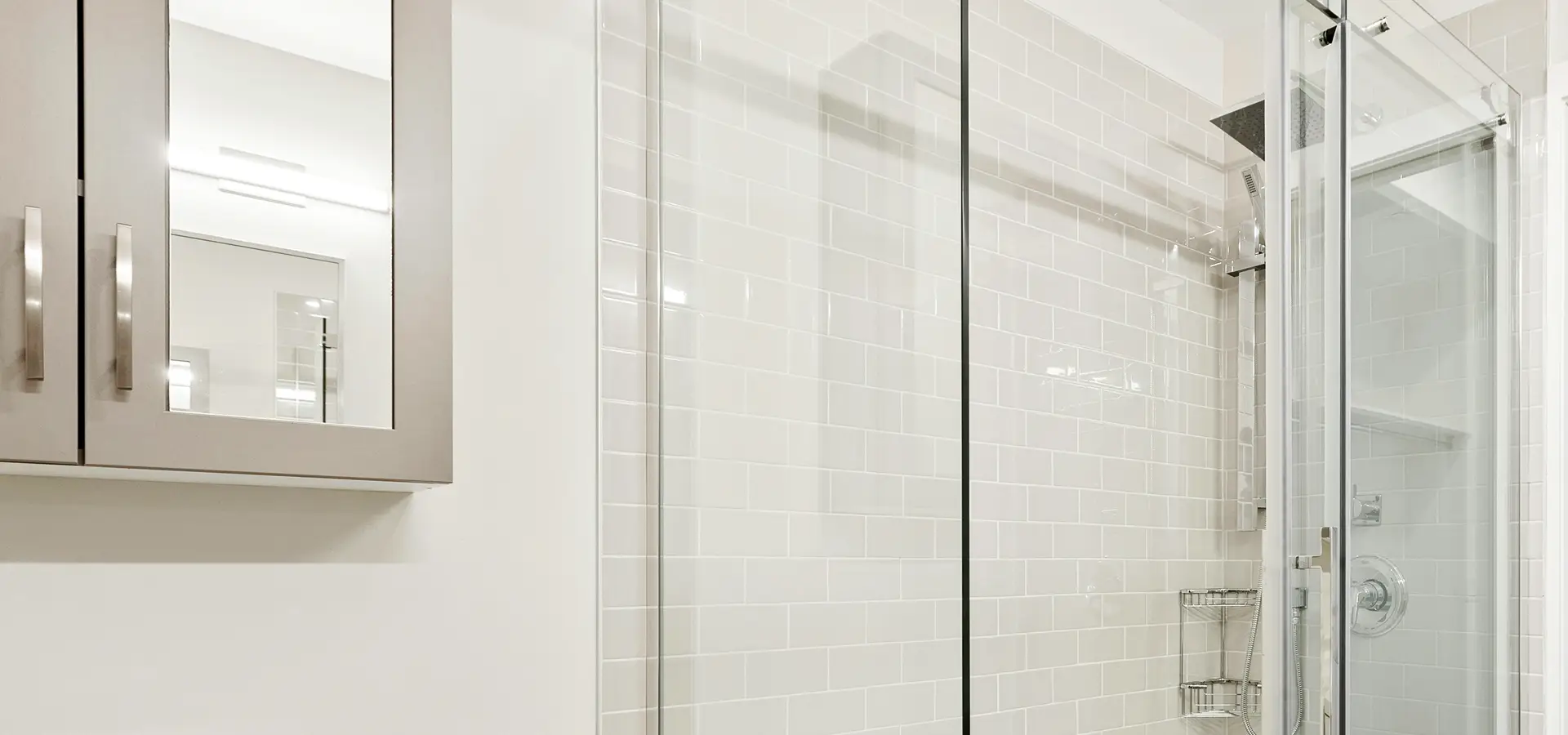 Bathroom with White Subway Tile and Glass Doors